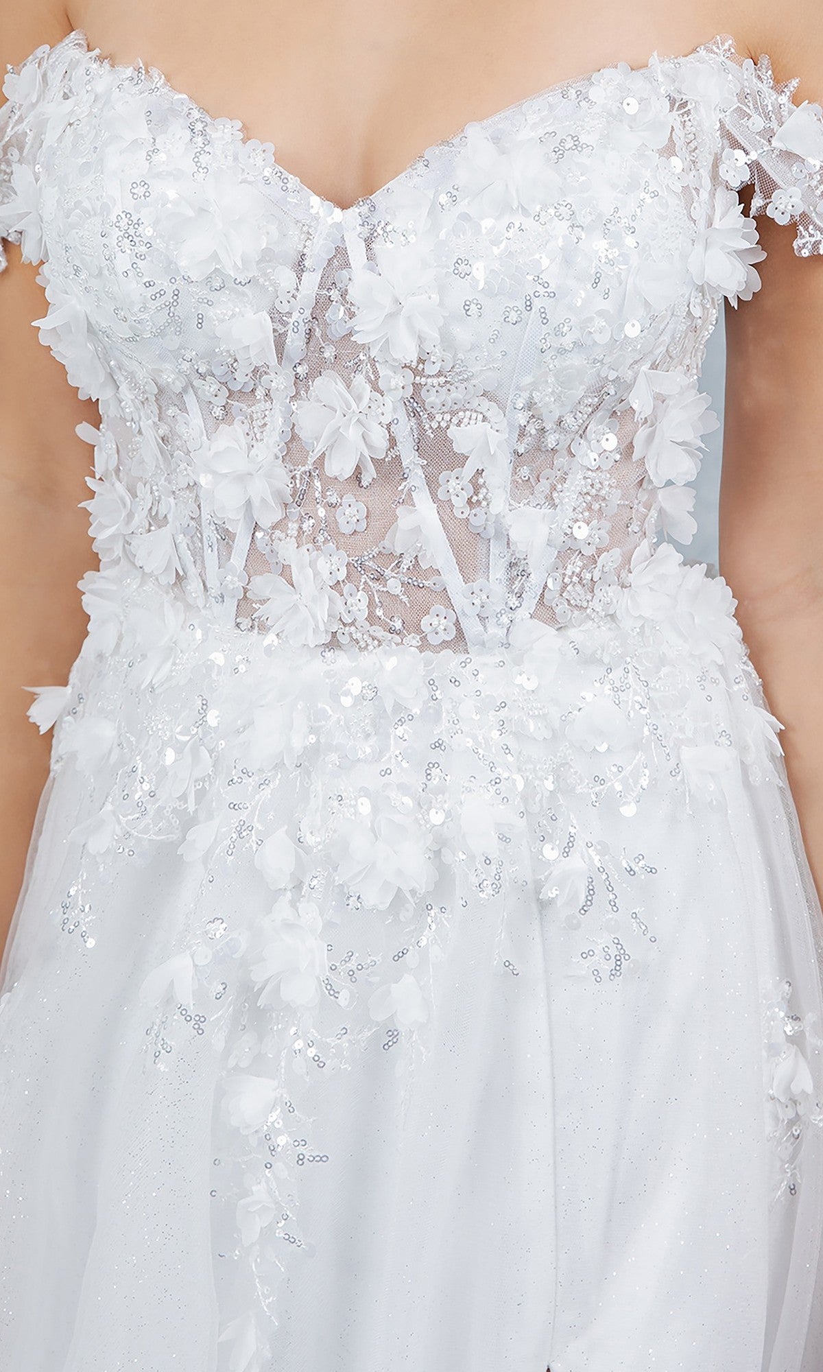 Close-up of the Cinderella Couture 8403J long prom dress in white, showcasing an off-the-shoulder design with floral appliqué, sequins, and a sheer lace bodice for an ethereal effect.